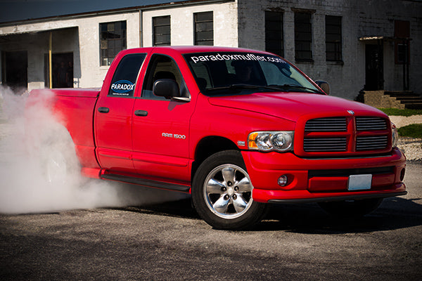 Paradox Muffler branded Ram 1500 truck doing a burnout